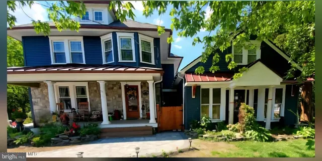 front view of a building with a garden