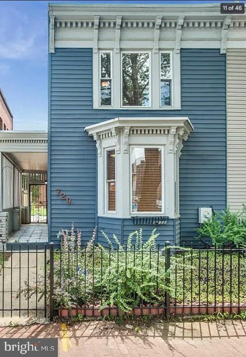 Charming blue facade with vintage details.