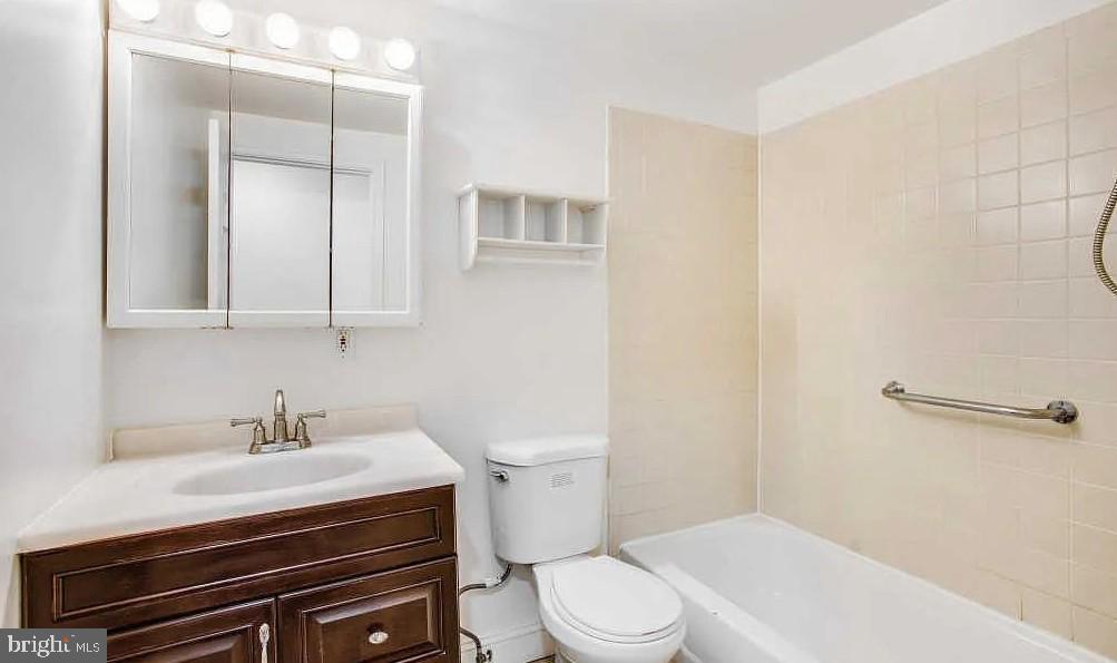 729 10th Street Northeast Washington, DC 20002 - Photo 12 of 15 a bathroom with a sink a toilet and shower