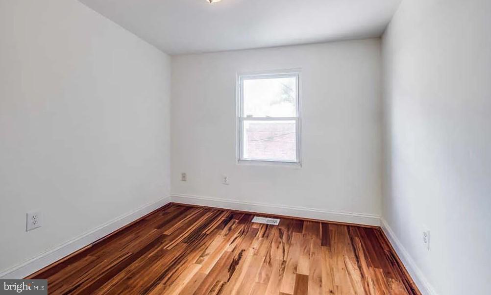 729 10th Street Northeast Washington, DC 20002 - Photo 13 of 15 a view of a room with wooden floor and small window
