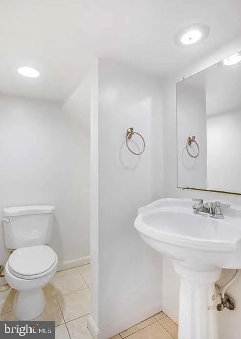 729 10th Street Northeast Washington, DC 20002 - Photo 5 of 15 a bathroom with a toilet sink and mirror