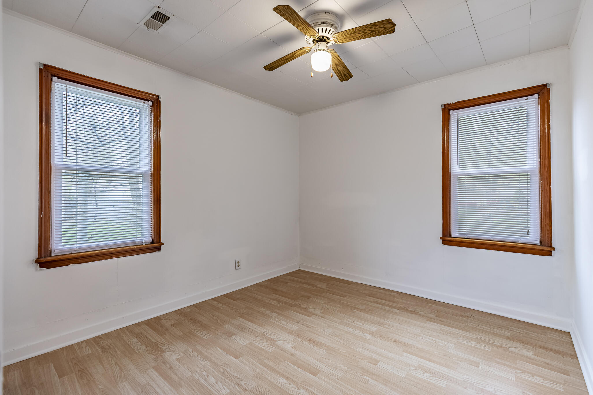 2392 Wheeler Street Gary, IN 46406 - Photo 11 of 17 an empty room with a window and a ceiling fan