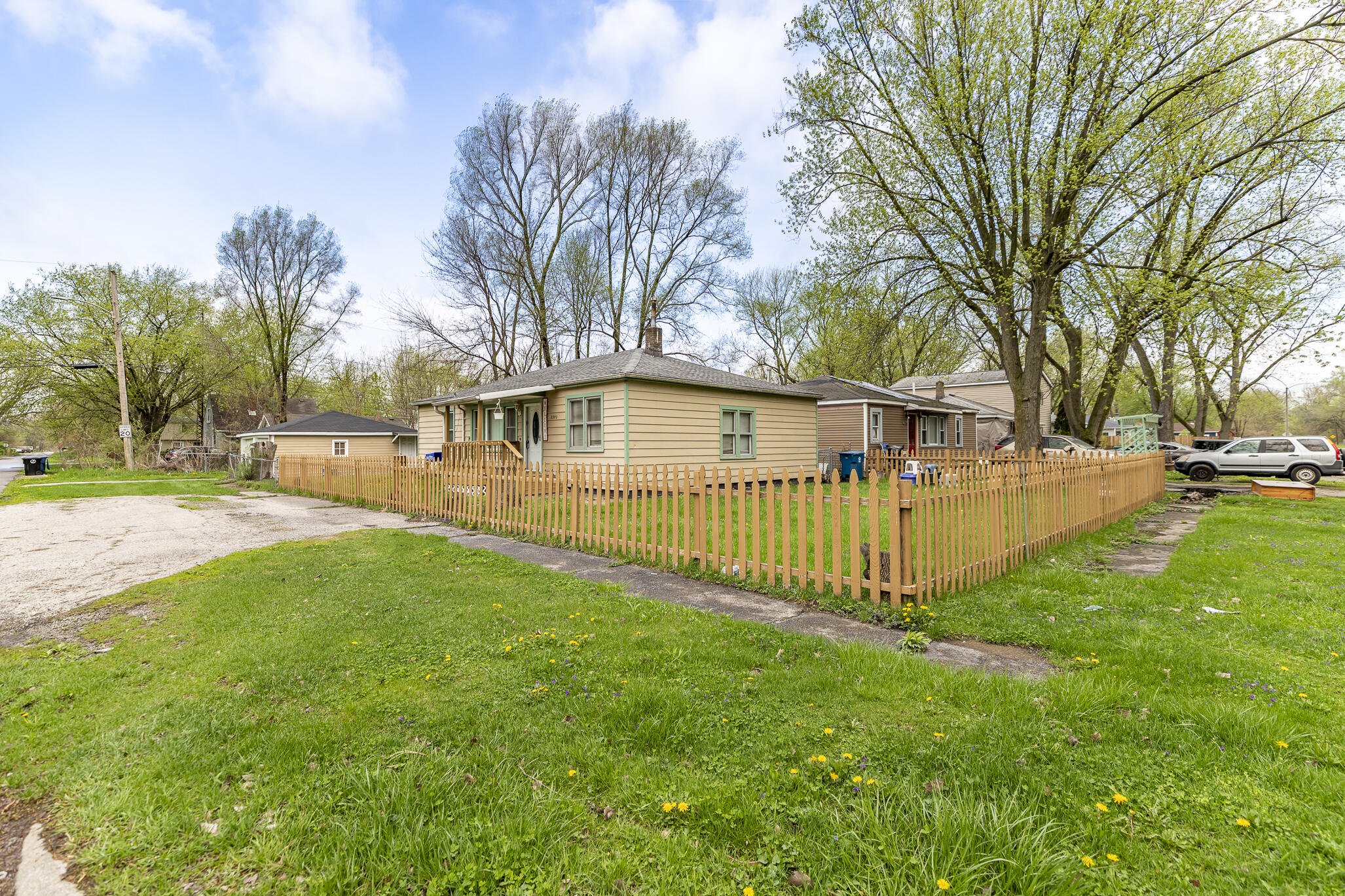 2392 Wheeler Street Gary, IN 46406 - Photo 14 of 17 a view of a house with a yard and a patio