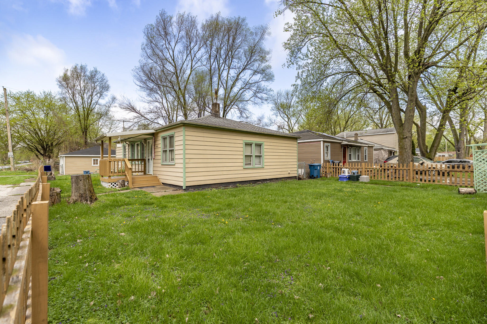 2392 Wheeler Street Gary, IN 46406 - Photo 15 of 17 a front view of a house with a garden