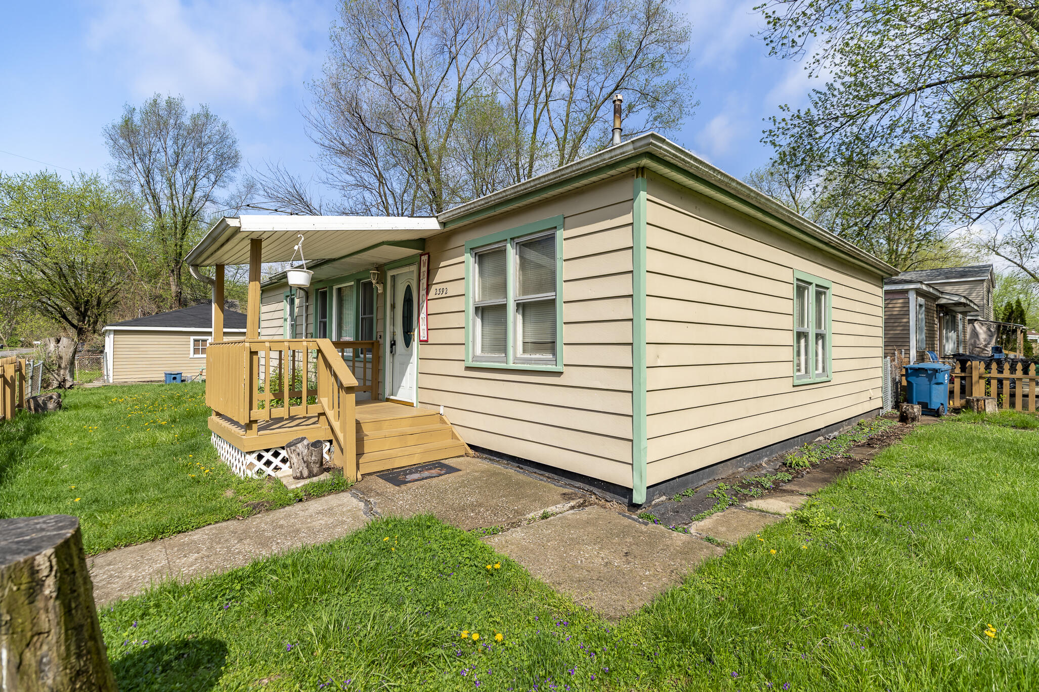 2392 Wheeler Street Gary, IN 46406 - Photo 17 of 17 a view of a white house with a yard table and chairs