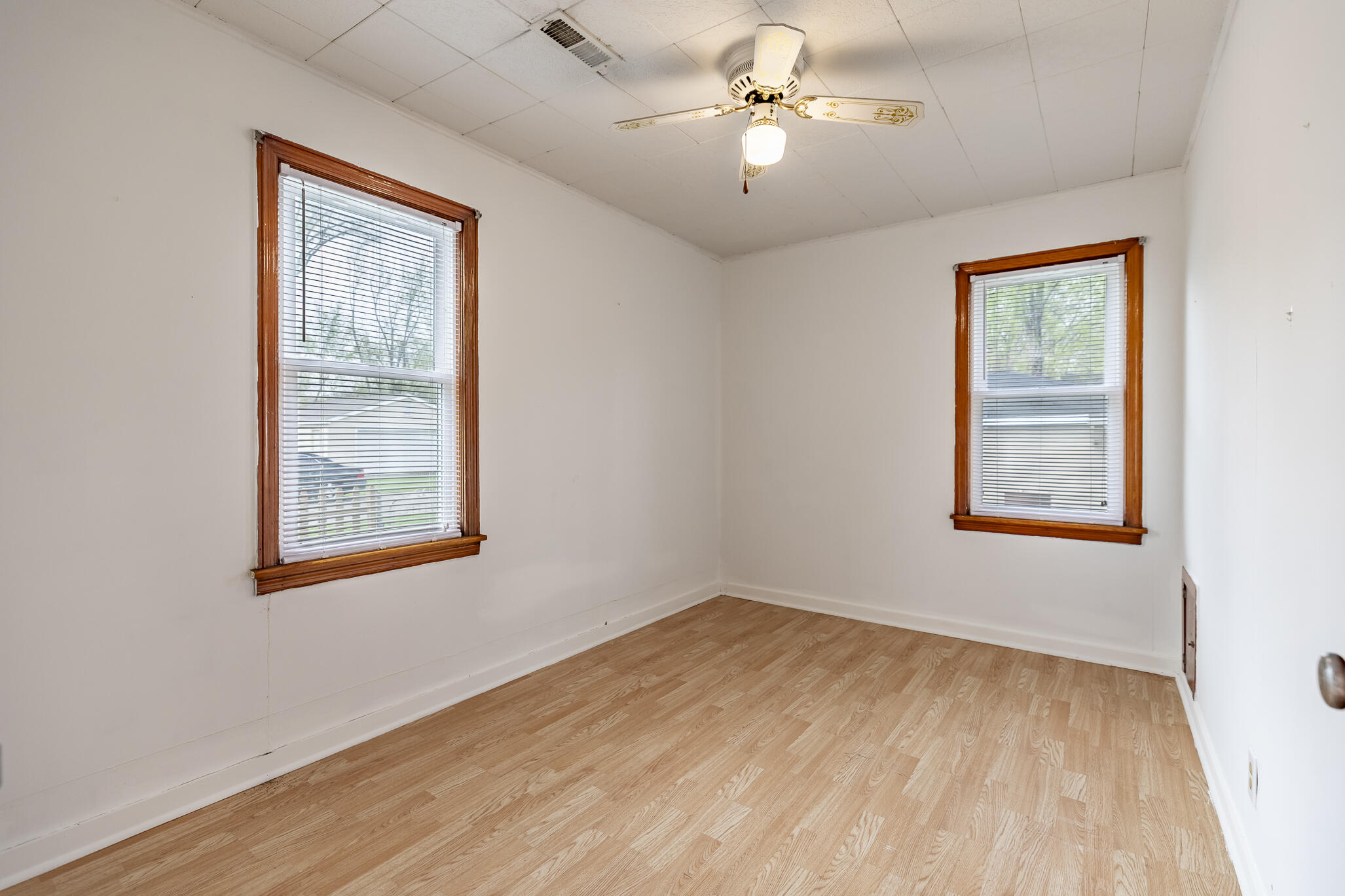 2392 Wheeler Street Gary, IN 46406 - Photo 8 of 17 a view of an empty room with a window and a ceiling fan