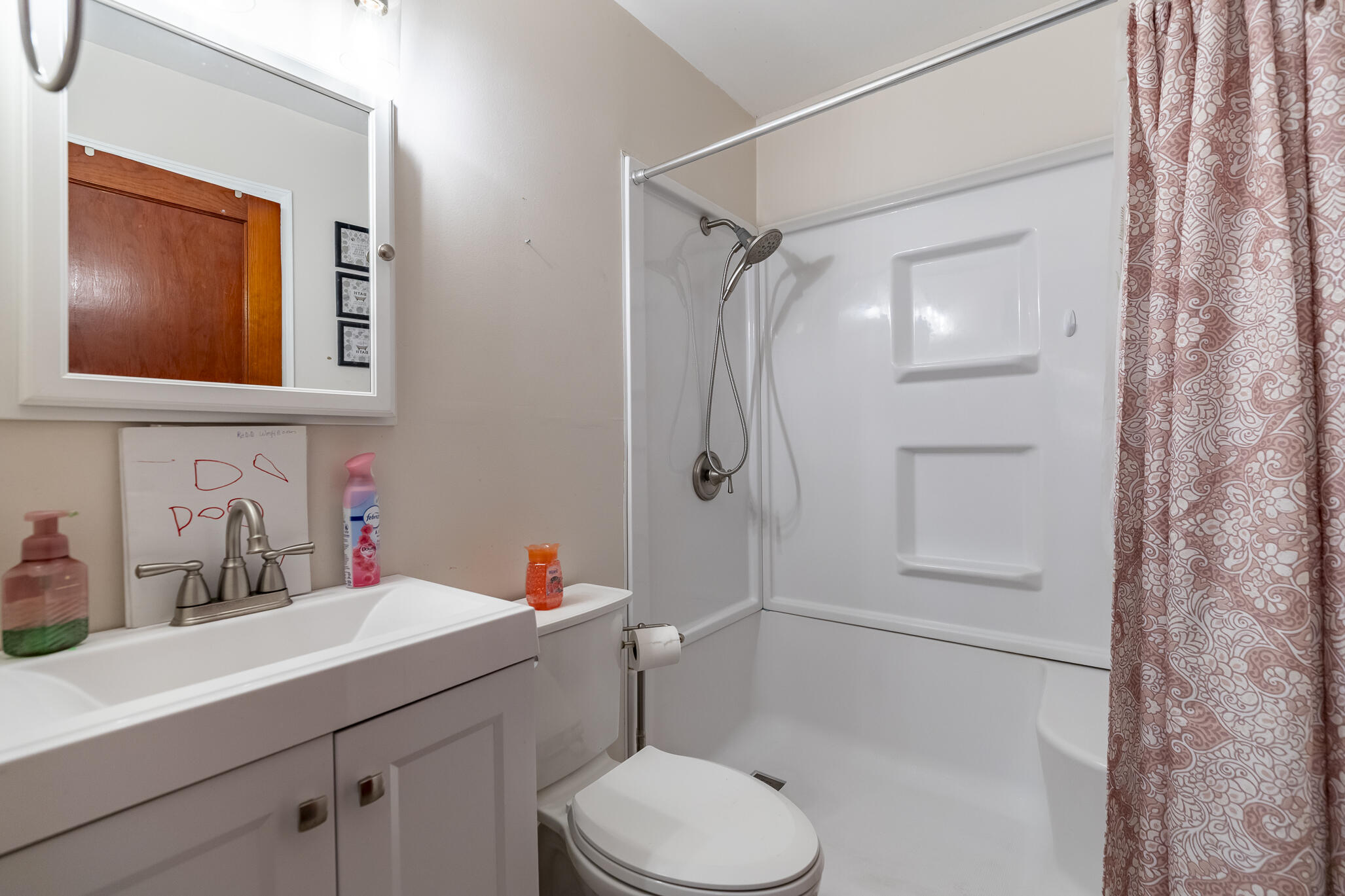2392 Wheeler Street Gary, IN 46406 - Photo 9 of 17 a bathroom with a toilet sink and shower