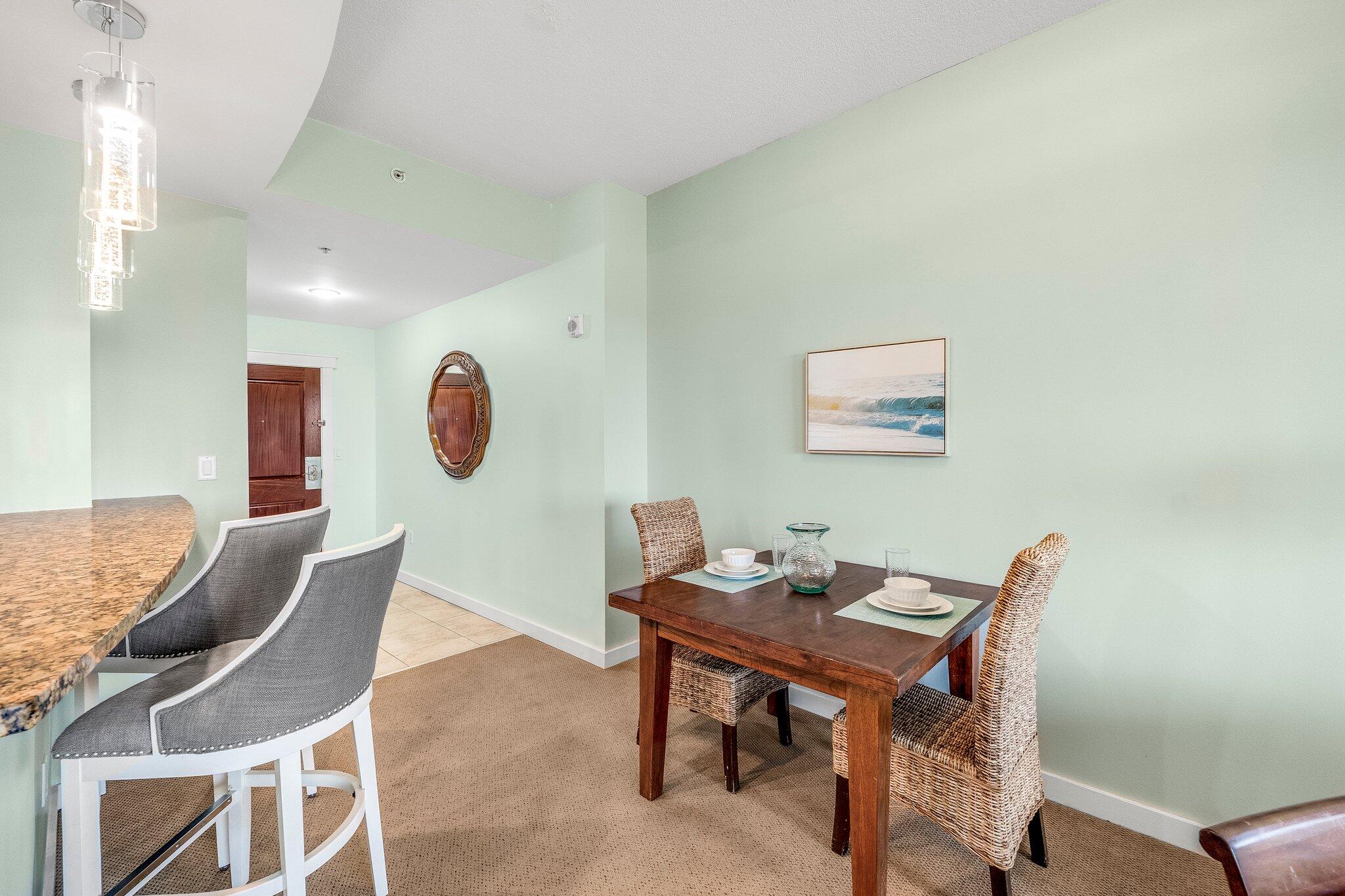 15100 Front Beach Road, Unit 517 Panama City Beach, FL 32413 - Photo 12 of 21 a view of a dining room with furniture