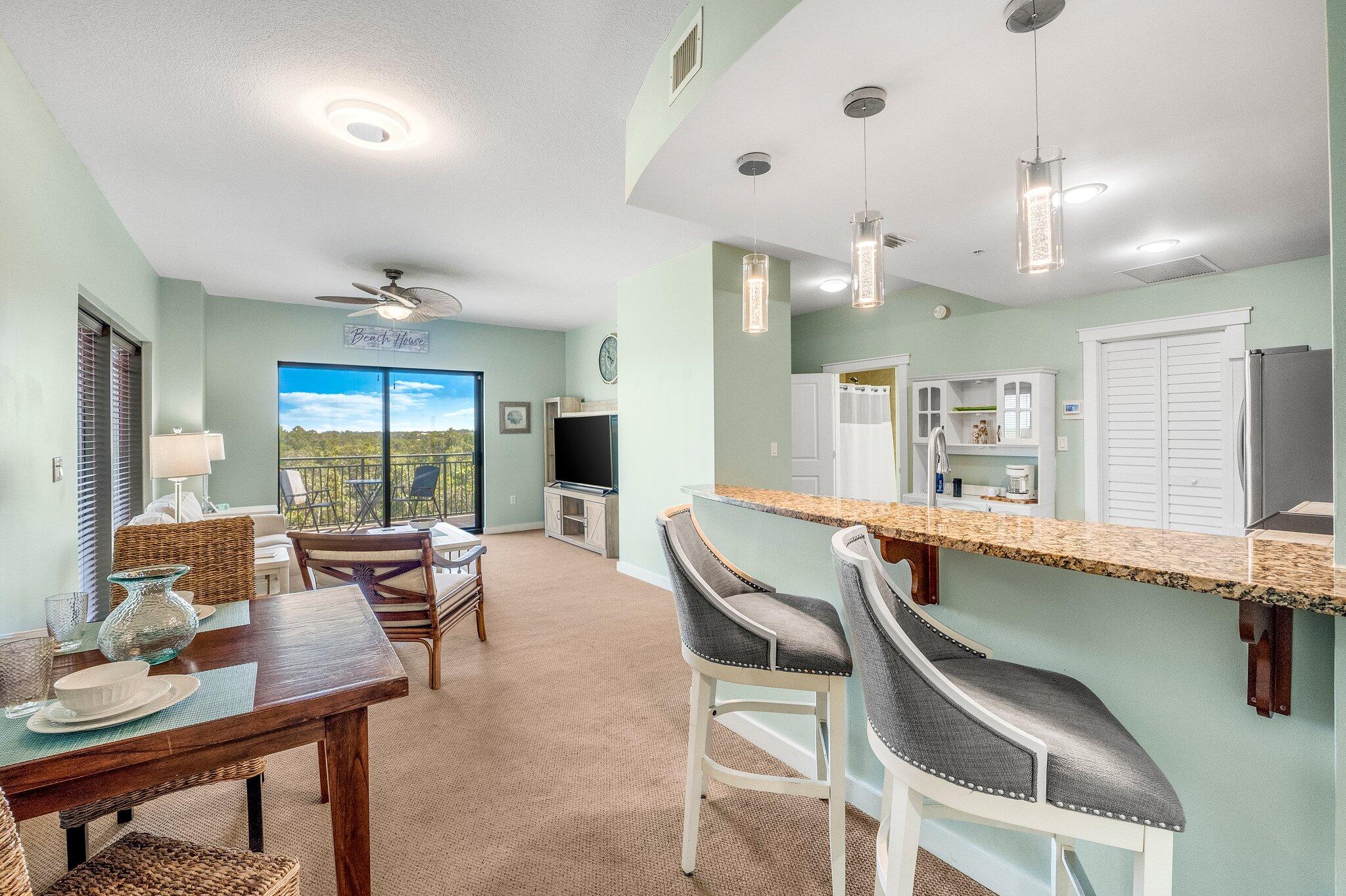 15100 Front Beach Road, Unit 517 Panama City Beach, FL 32413 - Photo 13 of 21 a dining room with furniture and window