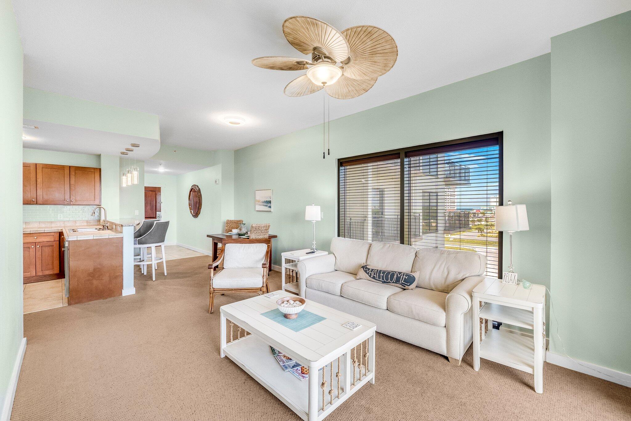 15100 Front Beach Road, Unit 517 Panama City Beach, FL 32413 - Photo 17 of 21 a living room with furniture and a large window