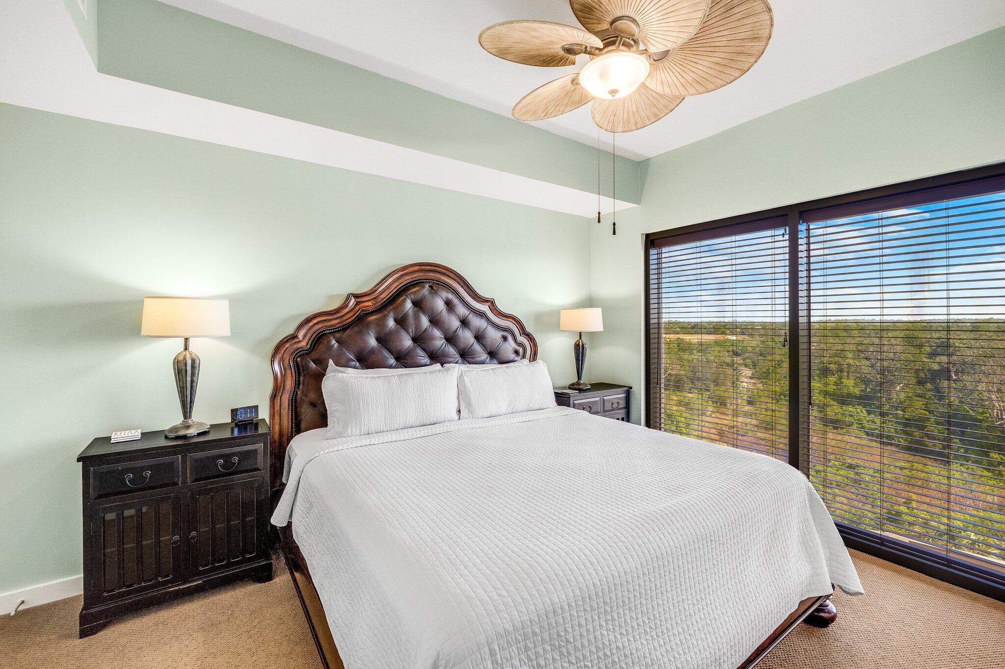 15100 Front Beach Road, Unit 517 Panama City Beach, FL 32413 - Photo 3 of 21 a bedroom with a large bed and a chandelier