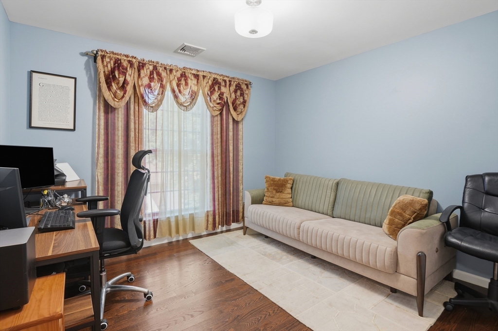 112 Pineland Avenue Worcester, MA 01604 - Photo 23 of 38 a living room with furniture and a flat screen tv