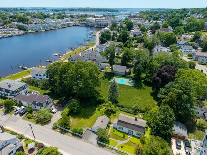 an aerial view of a house with a lake view