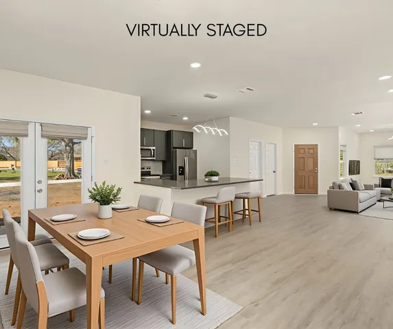 a living room with furniture and a table