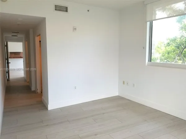 a bathroom with a toilet and a bathtub