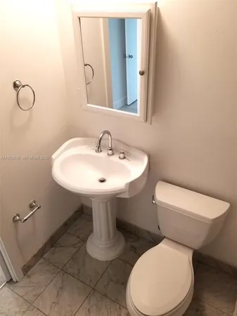 a kitchen with stainless steel appliances granite countertop a sink and a refrigerator