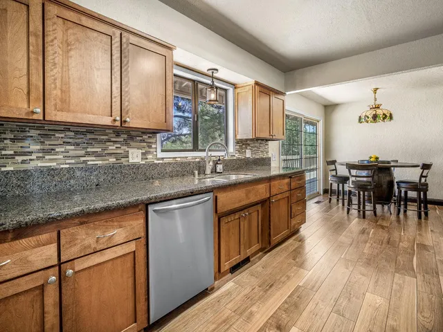 a kitchen with lots of counter top space and dining table