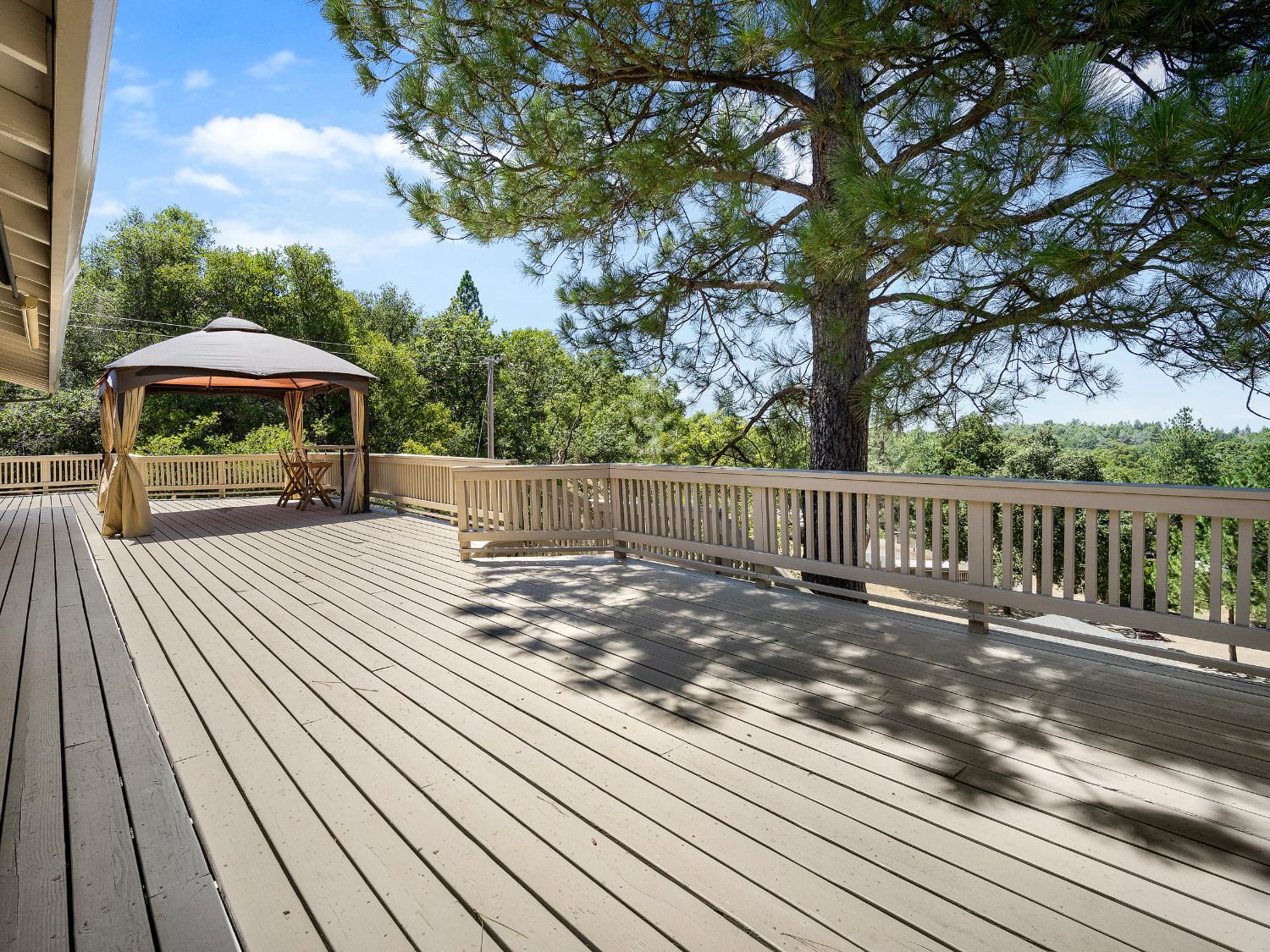 17065 Niles Road Jackson, CA 95642 - Photo 6 of 26 a view of a wooden deck next to a yard