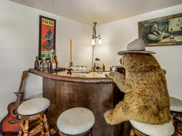 a bathroom with a toilet a sink and a mirror