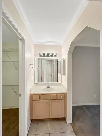 a white toilet sitting next to a bathroom sink