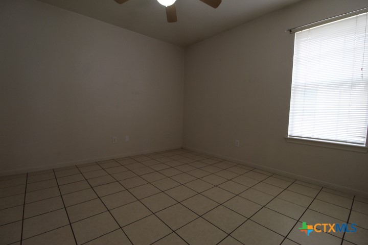 5211 James Loop Killeen, TX 76542 - Photo 7 of 18 an empty room and chandelier fan