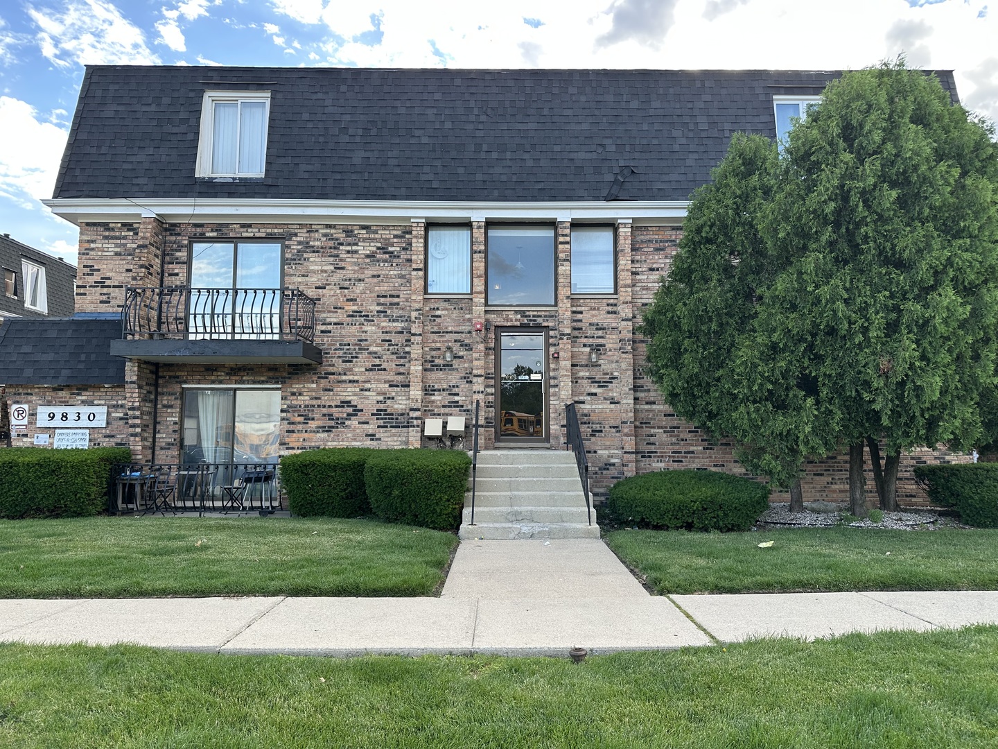 9830 Sayre Avenue, Unit 13 Chicago Ridge, IL 60415 - Photo 2 of 34 a front view of a house with a yard