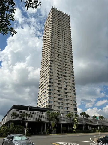 an empty room with wooden floor chandelier fan and windows