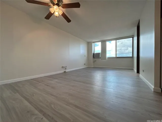 a view of a hallway with entryway and chandelier
