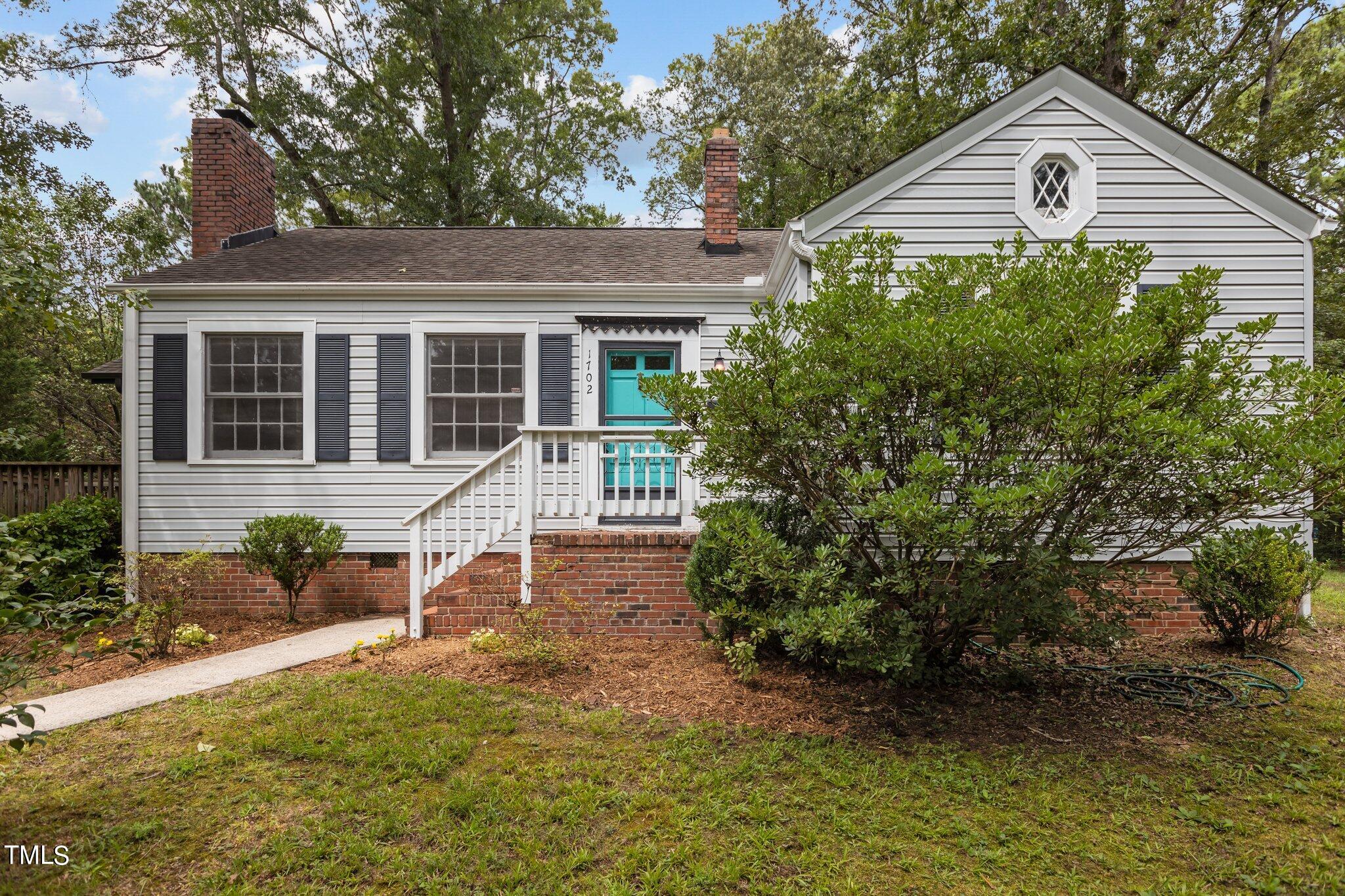 1702 James Street Durham, NC 27707 - Photo 1 of 40 a house view with a garden space