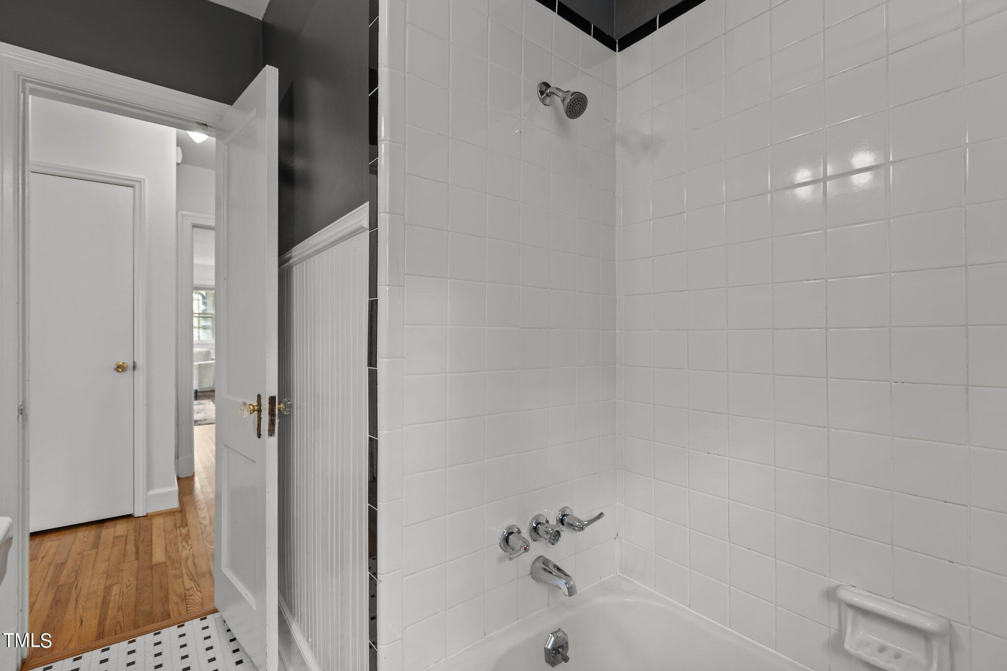 1702 James Street Durham, NC 27707 - Photo 12 of 40 a bathroom with a bathtub and a shower