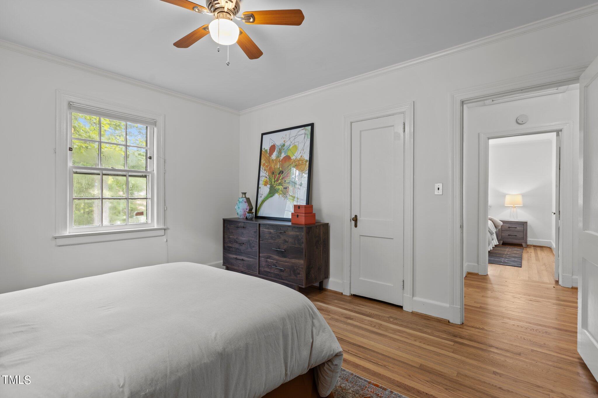 1702 James Street Durham, NC 27707 - Photo 14 of 40 a bedroom with a bed and wooden floor