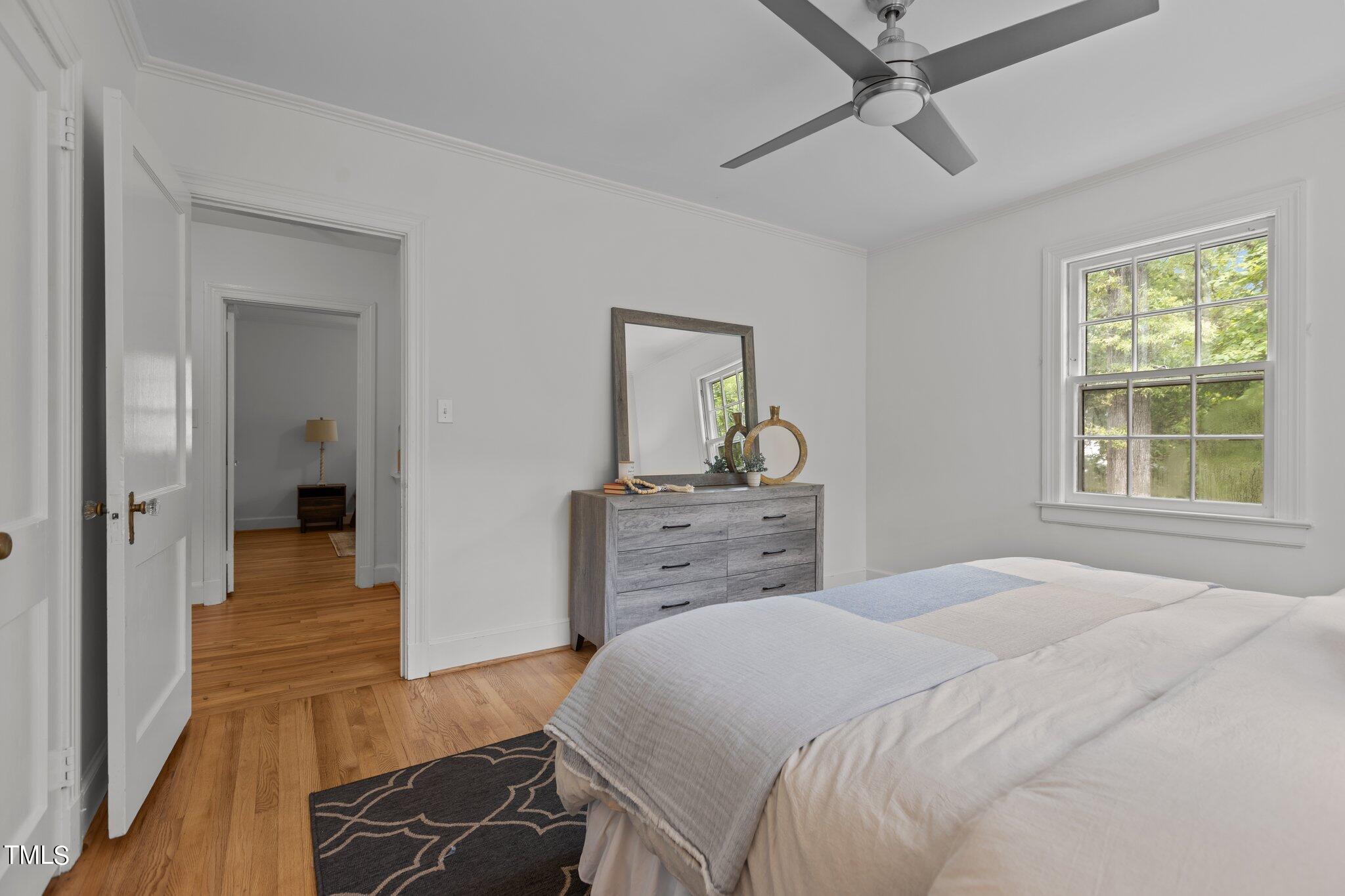 1702 James Street Durham, NC 27707 - Photo 16 of 40 a bedroom with a bed and a dresser