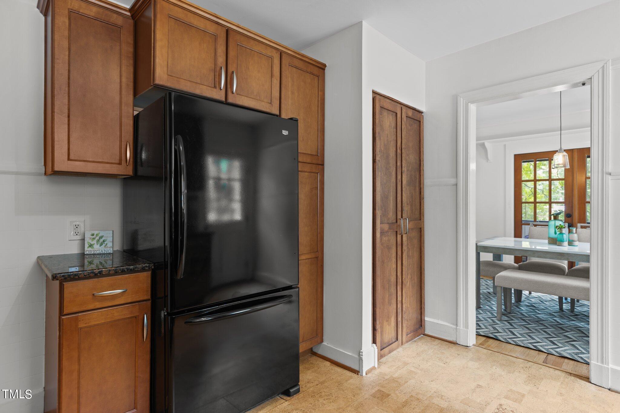 1702 James Street Durham, NC 27707 - Photo 18 of 40 a kitchen with stainless steel appliances granite countertop a refrigerator and a sink