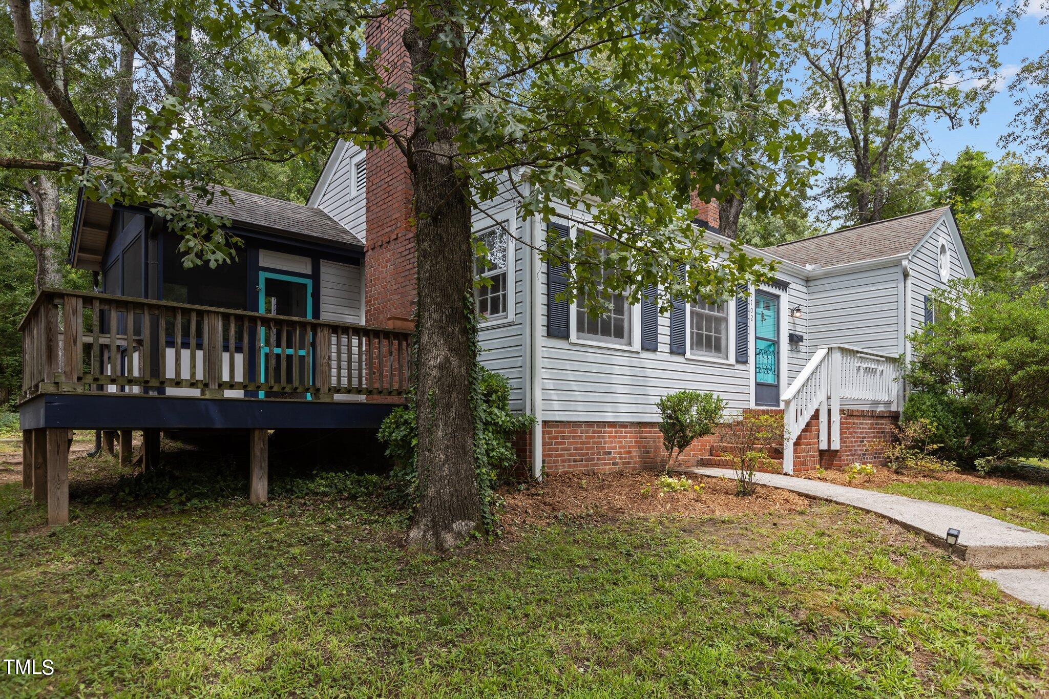 1702 James Street Durham, NC 27707 - Photo 2 of 40 a view of a house with backyard porch and sitting area