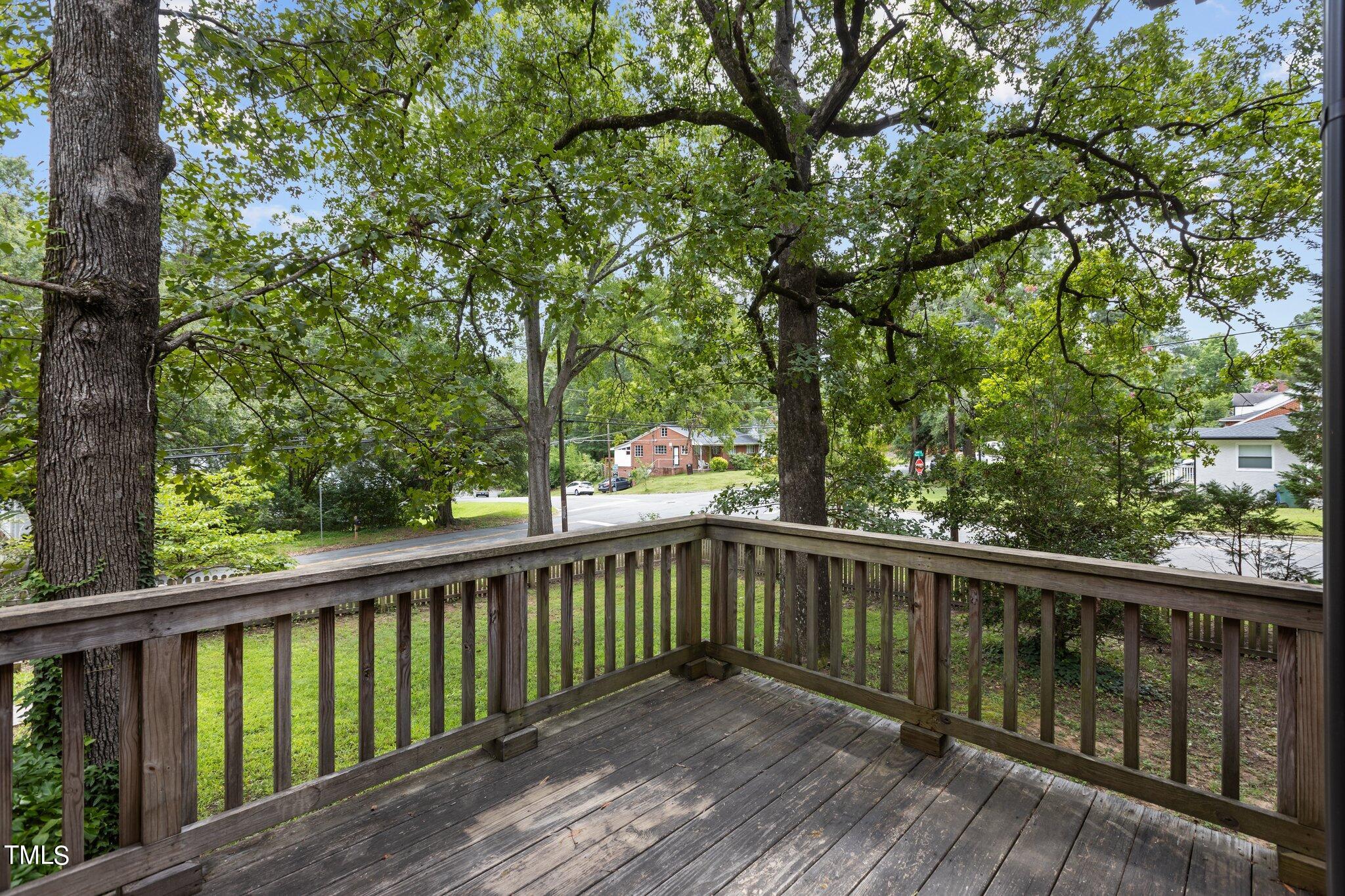 1702 James Street Durham, NC 27707 - Photo 23 of 40 a view of a wooden deck next to a yard