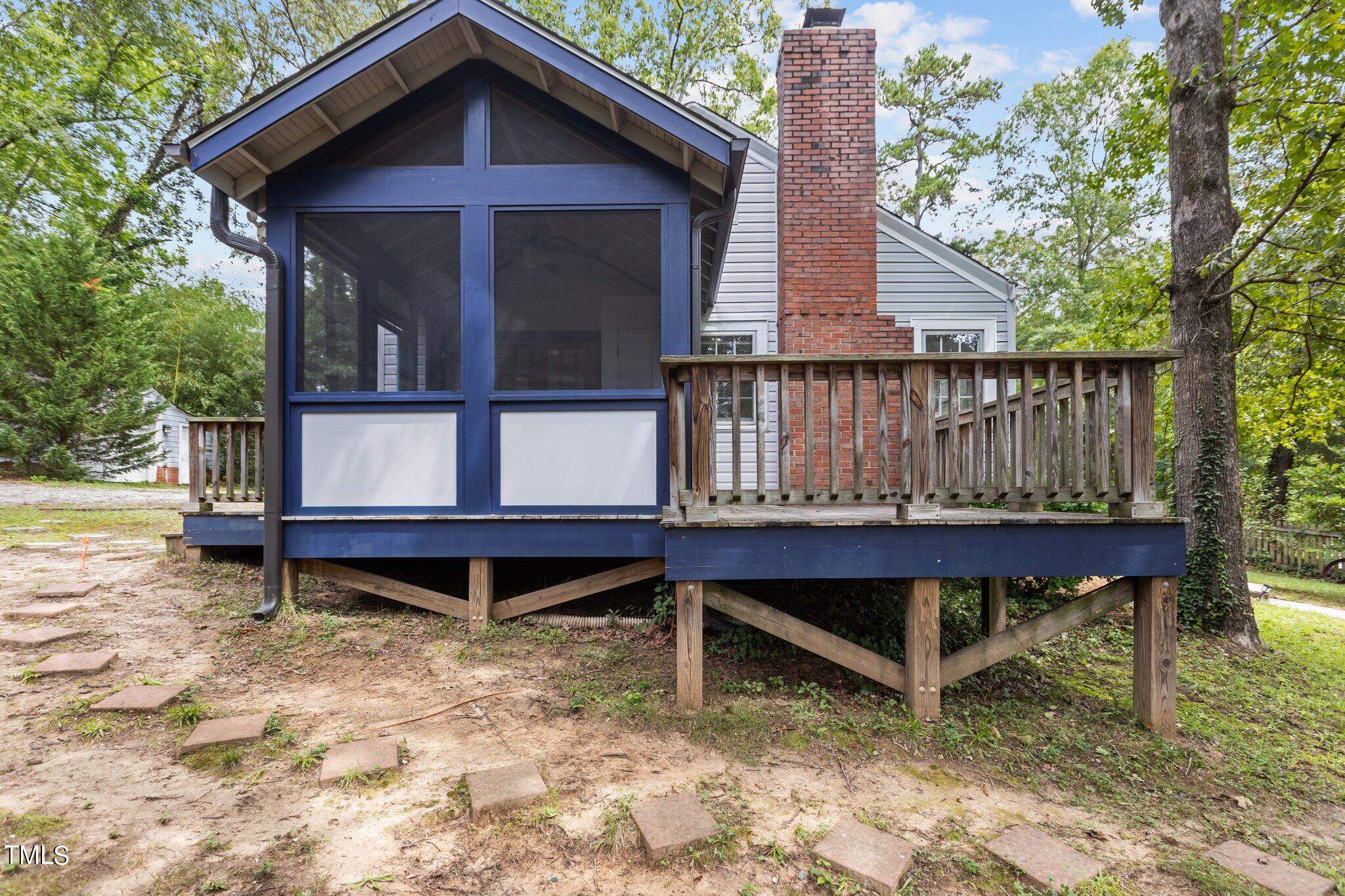 1702 James Street Durham, NC 27707 - Photo 25 of 40 a view of a wooden bench on the roof deck