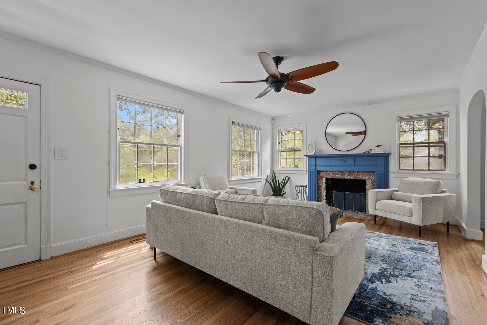 1702 James Street Durham, NC 27707 - Photo 4 of 40 a living room with furniture a window and a fireplace
