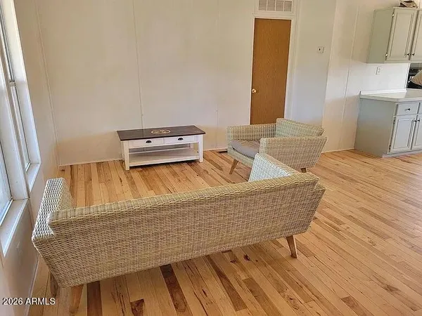 a living room with couch and a window