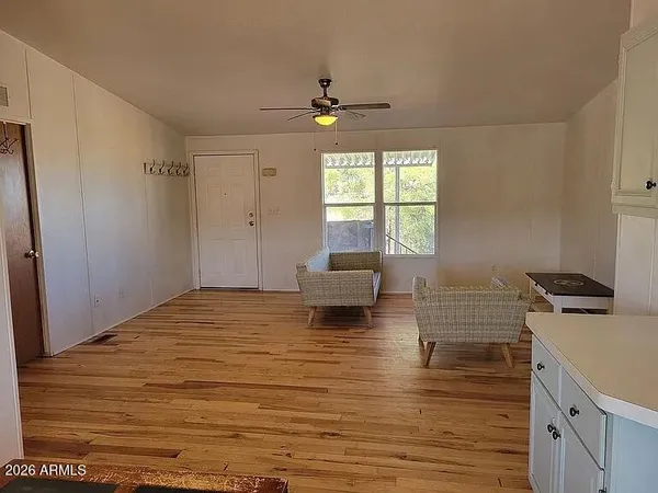 a kitchen with kitchen island a sink stove and wooden floor