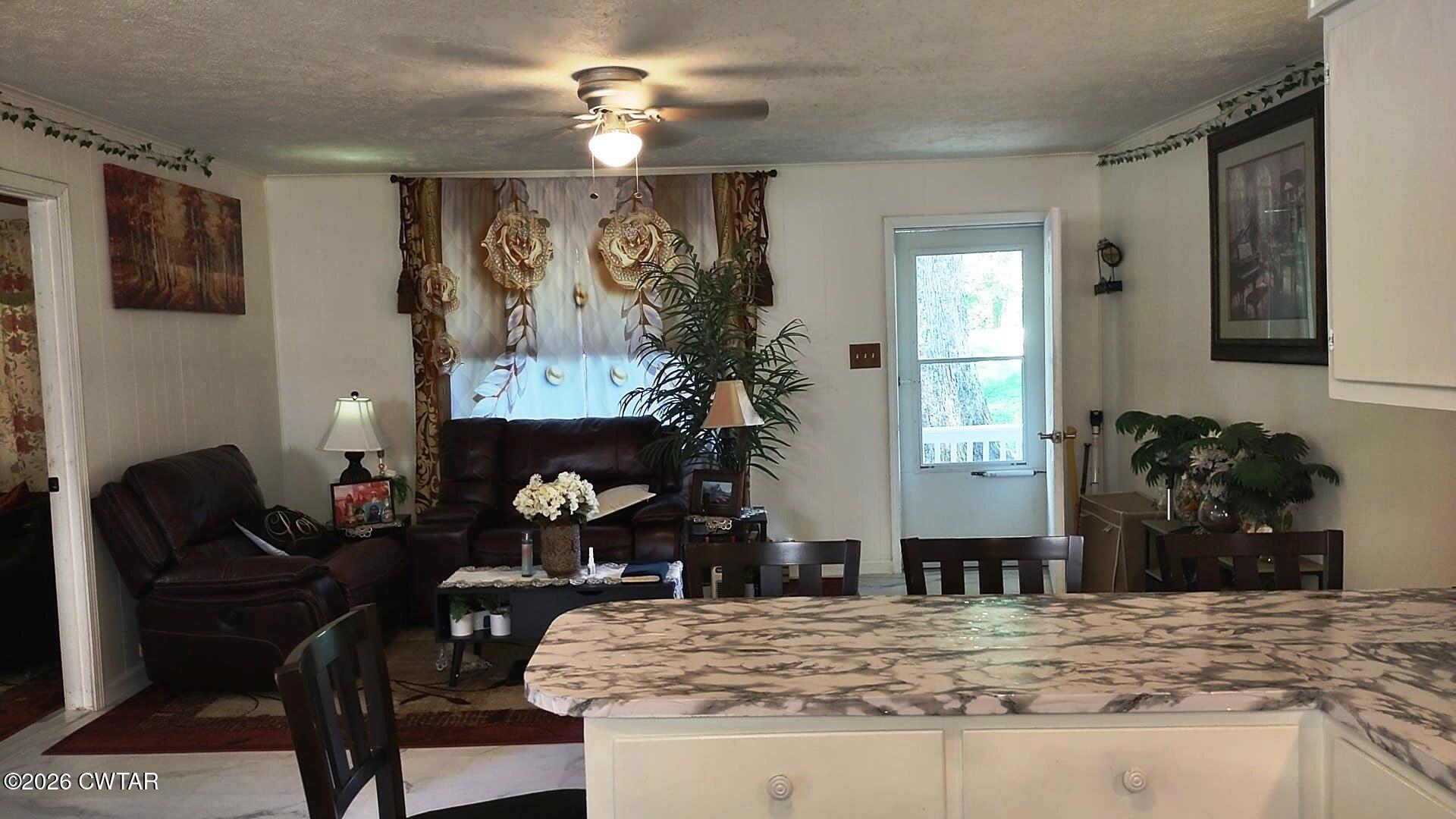195 Ridge Road Medina, TN 38355 - Photo 6 of 14 a living room with furniture and a fireplace
