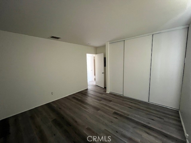 73740 Santa Rosa Way, Unit 5 Palm Desert, CA 92260 - Photo 15 of 20 a view of an empty room and wooden floor
