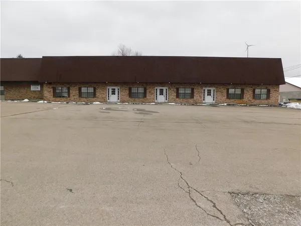 a front view of a building with road