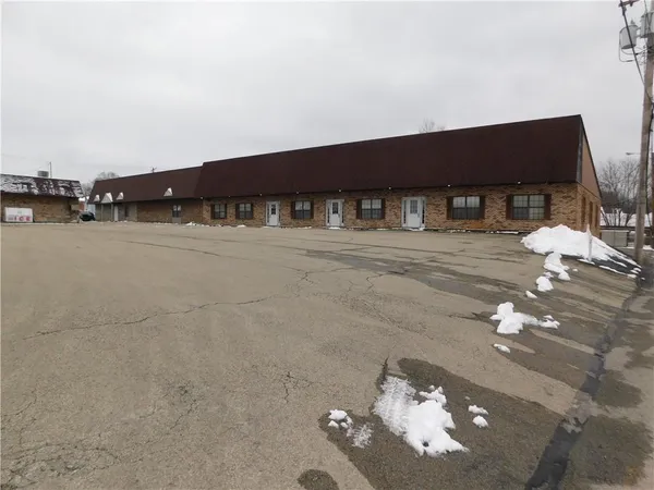a front view of a house with parking
