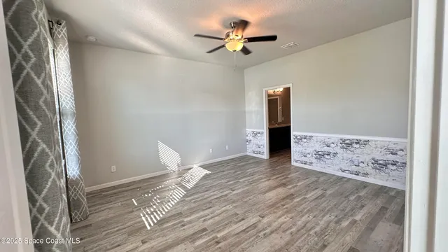 a bathroom with a glass door shower