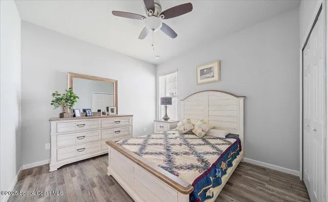 an empty room with wooden floor and a window