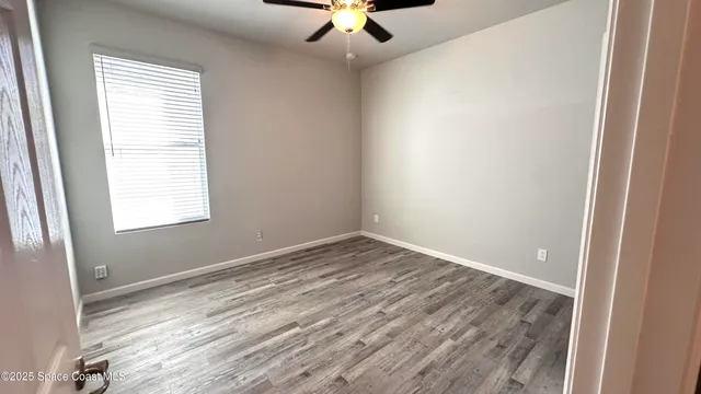 a view of a living room and floor to ceiling window