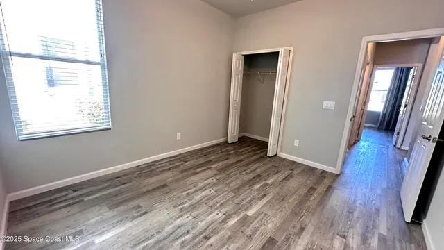 a view of a house with backyard porch and sitting area