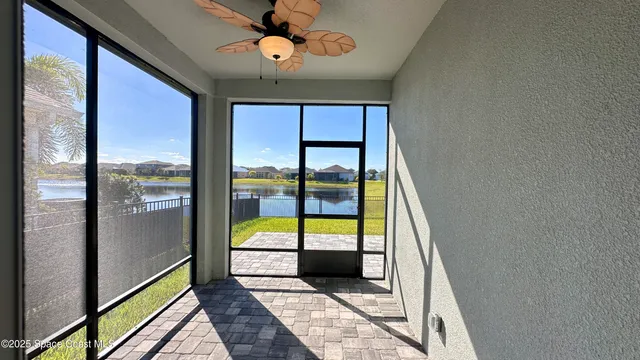 a front view of a house with a garden and parking