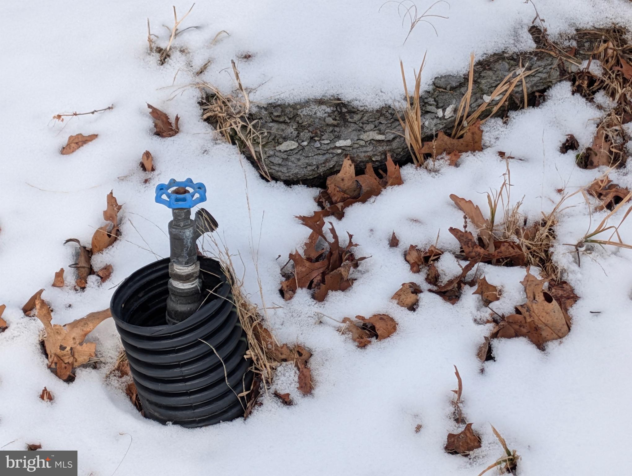 247 Short Cut Road Alum Bank, PA 15521 - Photo 11 of 15 a bathroom with a sink and a vase of flowers