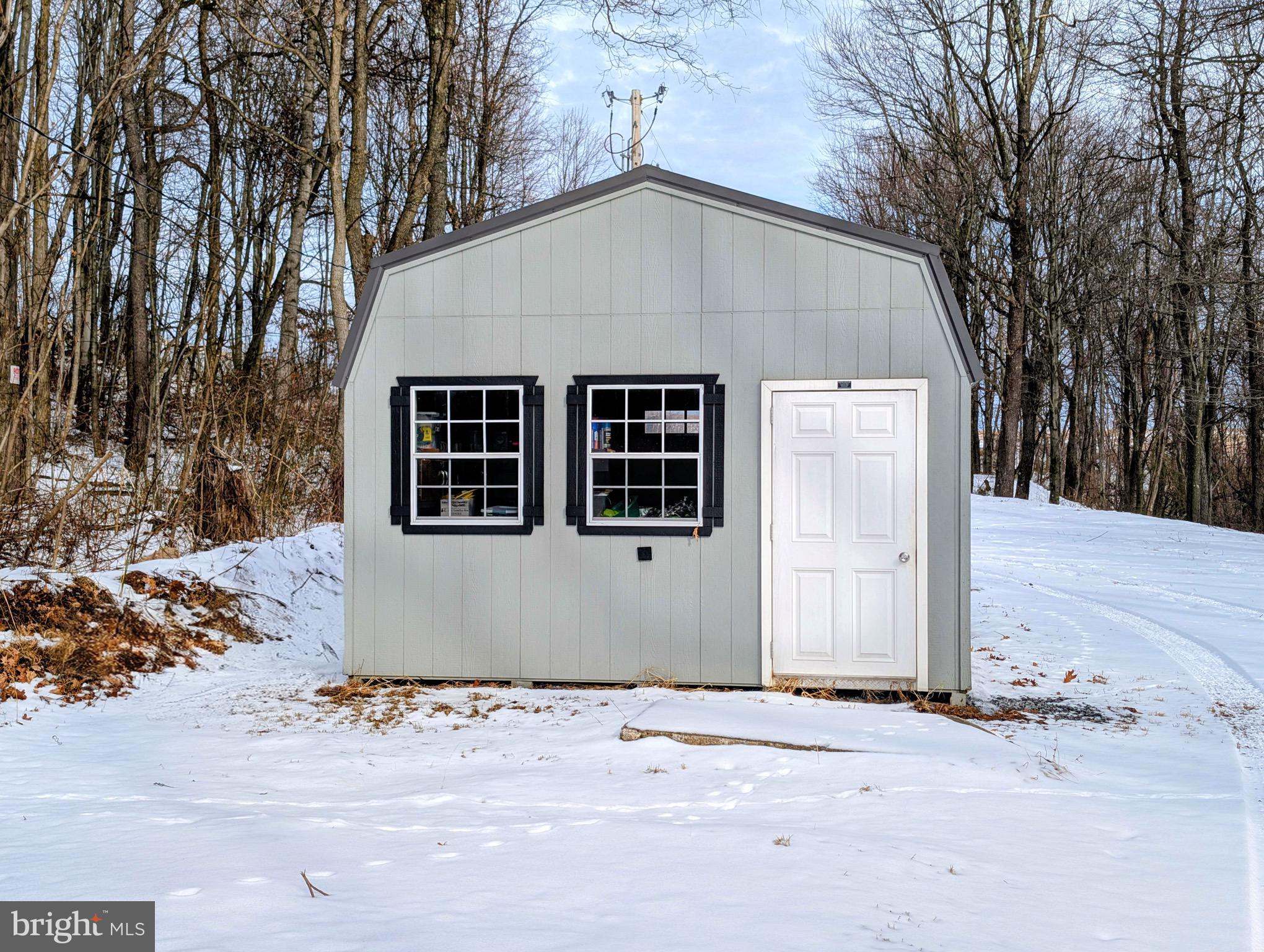 247 Short Cut Road Alum Bank, PA 15521 - Photo 12 of 15 a house with trees in the background
